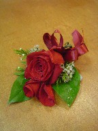 Red rose and waxflowers