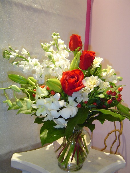 Roses, dendrobium orchids, alstroemeria, hypericum, lilies, and stock