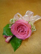 Pink rose and waxflowers