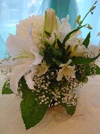 Lillies, commercial mum, orchids, alstroemeria, and baby's breath