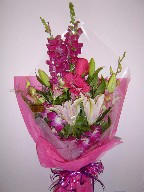 Snapdragon, gerbera, roses, lillies, orchids, and alstroemeria