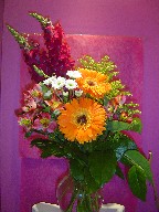 Gerbera, alstroemeria, daisies, solidago, and snapdragon