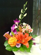 Rose, asiatic lilies, dendrobium orchid, alstroemeria, and pompoms