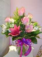 Roses, lillies, alstroemeria, snapdragon, and solidago