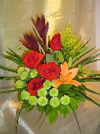 Roses, lillies, solidago, eucadendron, and pompoms