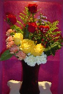 Roses, solidago, coffee beans, monte casino blue, and carnations