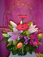 Gerbera, lillies, solidago, tulips, daisies, heather, and curly willow