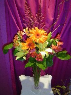 Roses, lillies, gerbera, astilbe, and curly willow