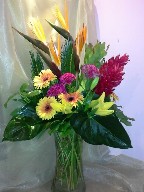 Bird of paradise, ginger, gerbera, celosia, asiatic lillies, sago palm, eucadendron, and anthurium leaves