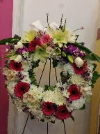 Gerbera, cymbidium orchids, roses, asiatic lillies, spider mums, dendrobium orchids, flat mums, commercial mums, pompoms, waxflowers, and aspidestra