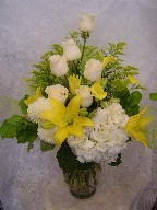 Hydreangea, lillies, calla lillies, roses, commercial mum, alstroemeria, and solidago