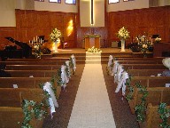 Altar arrangements and aisle decorations