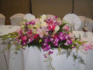 Gladiolas, cymbidium and dendrobium orchids, lillies, roses, gerbera, and waxflowers