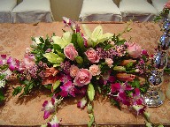 Roses, lillies, waxflowers, orchids, and carnations